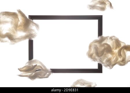 Black frame among white clouds on a white background Stock Photo