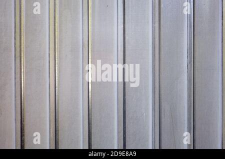 White corrugated metal or zinc texture surface or galvanize steel in the vertical line background. Close-up of zinc wall background Stock Photo