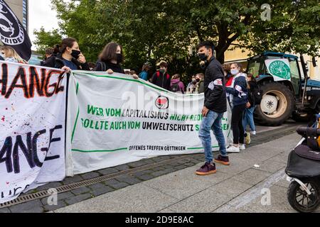 Gottingen, Germany. Autumn 2020. Fridays for future. Protesters holding banners at protest against capitalism and climate change. Stock Photo