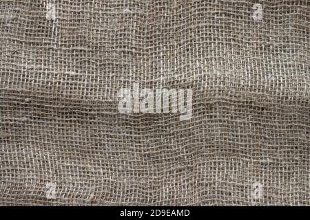 Texture of crumpled natural burlap close-up. Stock Photo
