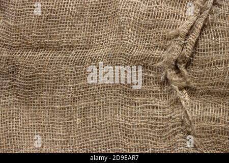 Texture of crumpled natural burlap close-up. Stock Photo