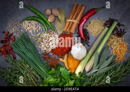 Herbs and Spices on a grey slate background. Stock Photo