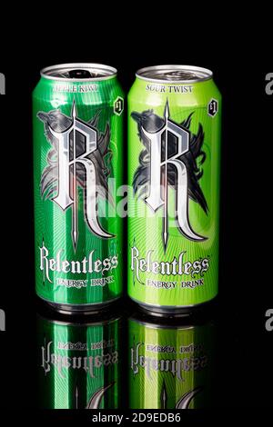 London, United Kingdom, 14th October 2020:- Cans or Relentless Apple Kiwi & Sour Twist Energy Drinks Isolated on a black background Stock Photo