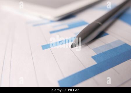 financial graph, digital tablet and pen on table  Stock Photo