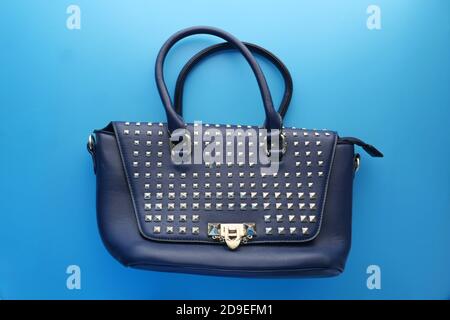 women purse wallet on blue background top view  Stock Photo