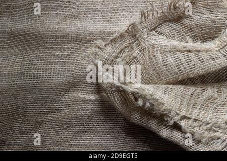 Texture of crumpled natural burlap close-up. Stock Photo