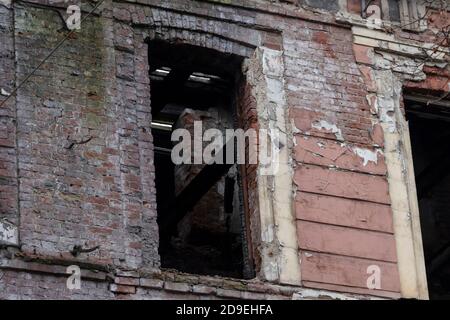 Broken windows in an old abandoned building about to be demolished. Stock Photo