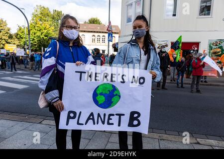 Gottingen, Germany. Autumn 2020. Fridays for future. Two young women posing with sign against climate change. Stock Photo