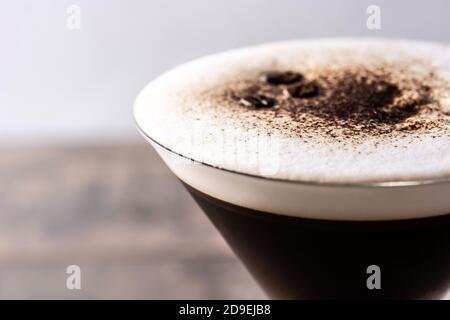 Martini espresso cocktail in glass on wooden table Stock Photo