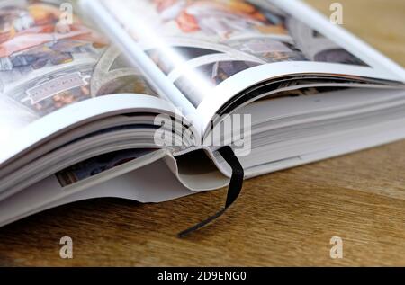 open renaissance art book on wooden table top Stock Photo