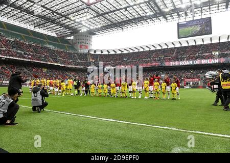 AC Milan and Frosinone soccer teams enter at the san siro soccer stadium for the italian serie A match, in Milan. Stock Photo