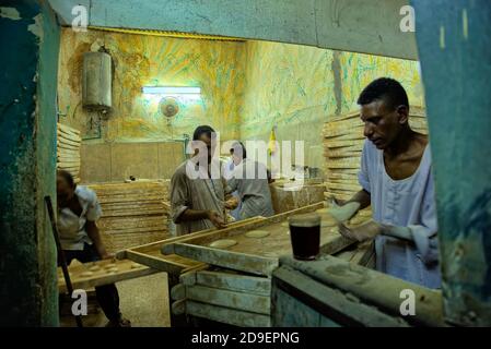 Making Egyptian Whole Grain Pita Bread in the Aswan Souk  Taken @Aswan, Egypt Stock Photo