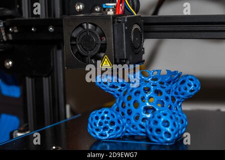 Modern 3D printer printing figure close-up macro. Stock Photo