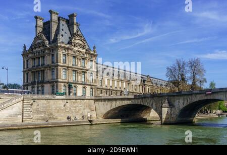 Paris, France, March 30, 2017: View of the Louvre Museum and Pont des arts, Paris - France Stock Photo