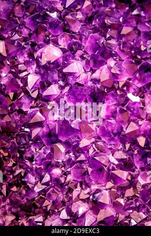 Amethyst purple crystal. Mineral crystals in the natural environment. Texture of precious and semiprecious gemstone Stock Photo