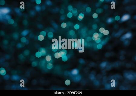 Christmas blue bokeh, lights in winter night, Abstract new year background Stock Photo