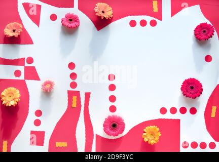 Organic paper shapes with gerbra flowers. Abstract geometric background in pink and yellow on white Stock Photo