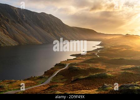 Aerial view of Wastwater lake in the English Lake District with rural road leading through the landscape. Stock Photo