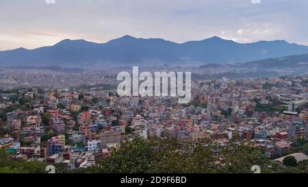 Panorama view over the west of densely populated Kathmandu, Nepal with Himalaya foothills (Chandragiri Hills) in background viewed from Swayambhunath.