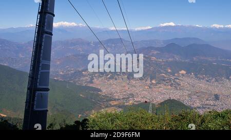 Stunning panorama view over Kathmandu valley, Nepal, with the mighty snow-capped Himalya mountain range in background and newly built Chandragiri hill. Stock Photo