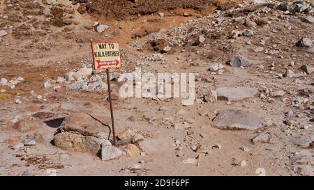 Rusty metal signpost showing the direction to the ascent of mountain Kala Patthar (5,645 m) in village Gorakshep near Mount Everest in the Himalayas. Stock Photo