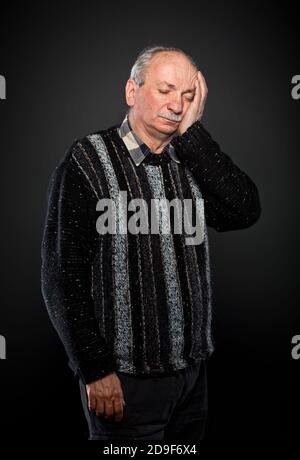 elderly man suffering from a toothache Stock Photo