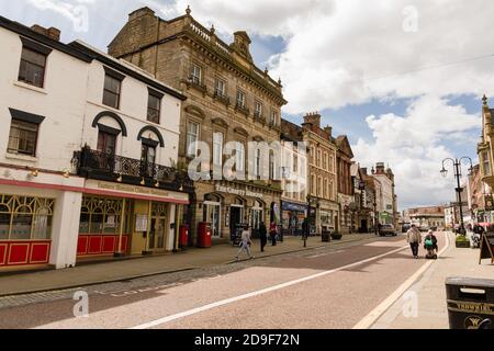 The High Street in Wrexham town centre  North Wales showing its varied and ornate Victorian period buildings and shops Stock Photo