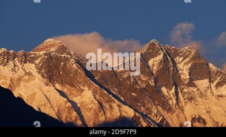 Spectacular view of Mount Everest (Sagarmatha) massif with majestic Lhotse south wall illuminated by the evening light viewed from Namche Bazar, Nepal. Stock Photo