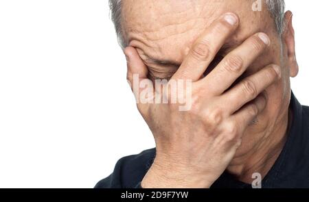 Pain. Elderly man covers his face with hand isolated on white ...