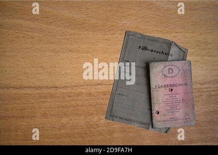 OLDENBURG, GERMANY - Oct 28, 2020: Germany, old used, dirty pink and grey German driving license Stock Photo