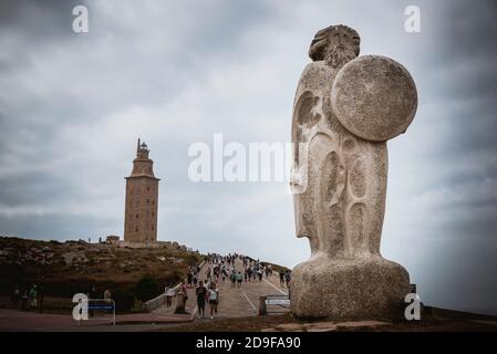 Statue of Breogan, according to the Irish tradition, Celtic king in the current territory of Galicia. In the background, the Tower of Hercules, La Cor Stock Photo