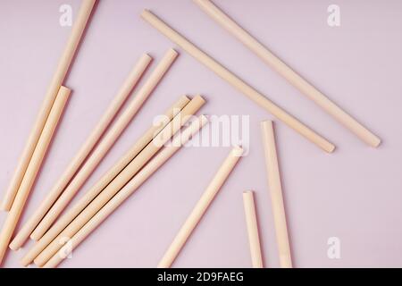 Bamboo straws straws on pink background. Stock Photo