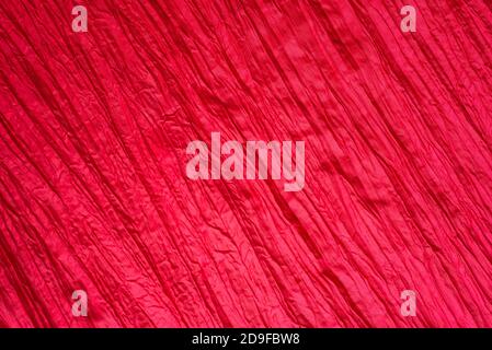 Horizontal red wrinkled background. Crumpled taffeta. Stock Photo