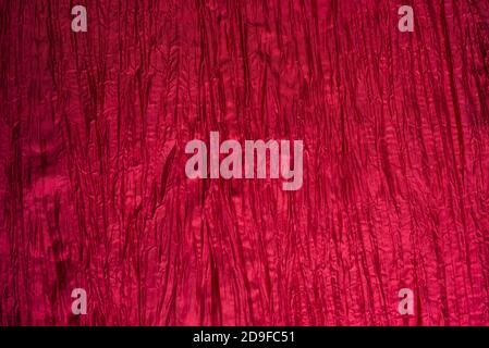 Red wrinkled taffeta background. Crumpled texture. Stock Photo