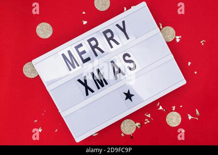 Text Merry Xmas meaning Merry Christmas on lightbox Stock Photo