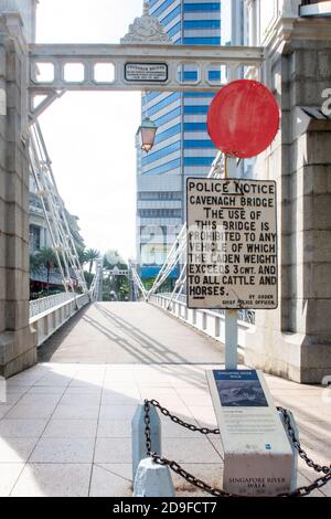 Cavenagh Bridge, only suspension bridge and one of the oldest bridges in Singapore, with Police Notice prohibiting any vehicle movement, no people. Stock Photo