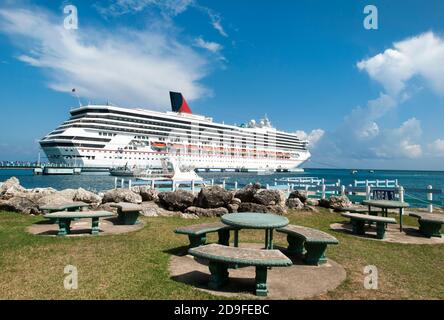 The picnic area with a view of a cruise ship moored in Ocho Rios resort town (Jamaica). Stock Photo