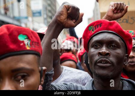 A protester making gestures during the demonstration.Members of Economic Freedom Fighters (EFF) take part in a labour march to the Department of Labour and SASSA offices targeting employers who have not paid their employees under the claims of the COVID-19 Temporary Employer-Employee Relief Scheme (TERS). Stock Photo