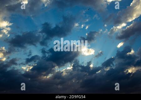 Sunlight beams and cloudy sky Stock Photo