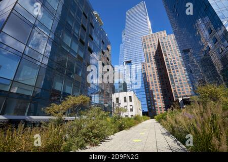 Walkway flanked with buildings in The High Line Park in New York City