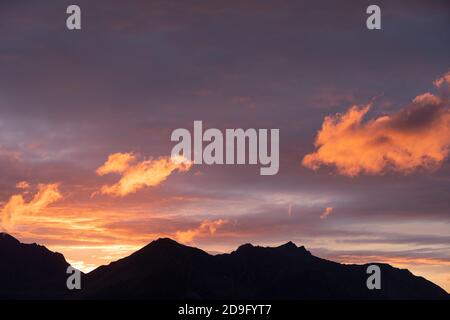 Colorful sunset over mountains in Norway Stock Photo