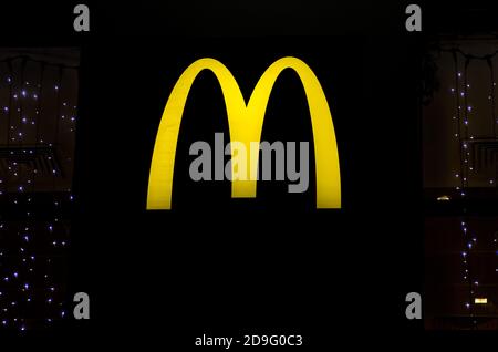 Chelyabinsk, Russia, December 31, 2019, glowing McDonald's logo on a black background Stock Photo