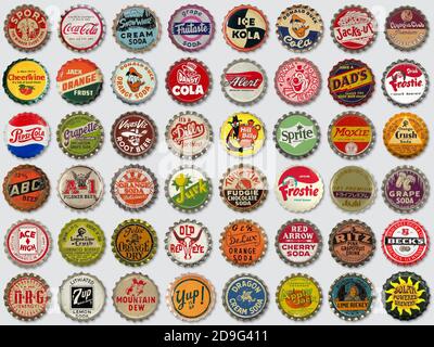 Collection of old used vintage soda and beer bottle caps on gray background Stock Photo