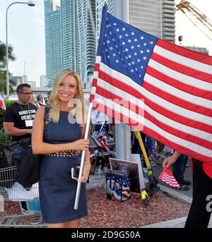 MIAMI, FLORIDA - JUNE 26: (EXCLUSIVE COVERAGE)  President Trumps Newly appointed White House Press Secretary Kayleigh McEnany joins Protesters outside prior to the first 2020 Democratic presidential debate including New York police officers that are protesting New York Mayor Bill de Blasio. A field of 20 Democratic presidential candidates was split into two groups of 10 for the first debate of the 2020 election, taking place over two nights at Knight Concert Hall of the Adrienne Arsht Center for the Performing Arts of Miami-Dade County on June 26, 2019 in Miami, Florida People:  Kayleigh McEna Stock Photo