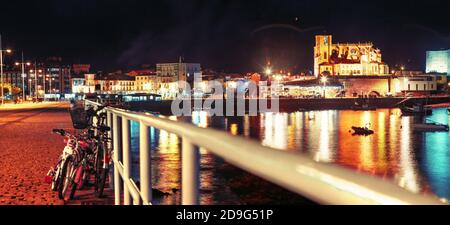 Scenery landscape of fishing port.Cityscape at night and boats in the sea.Cantabria village.Castrourdiales.Beautiful skyline panoramic in Spain landma Stock Photo