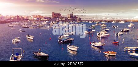 Scenery landscape of fishing port.Cityscape and boats in the sea.Cantabria village.Castrourdiales.Beautiful skyline panoramic in Spain landmark. Stock Photo