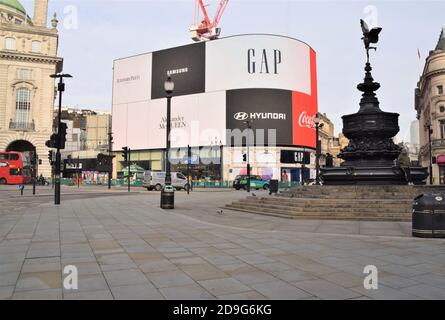 Daytime view of an empty and deserted Piccadilly Circus as people once again stay at home.Most shops, restaurants and businesses have closed as the second month-long nationwide Covid 19 lockdown begins in England. Stock Photo