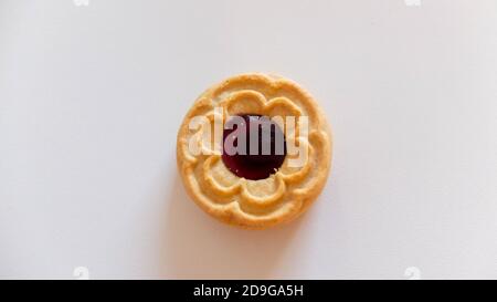 Round cookies with blueberry filling, isolated on light background Stock Photo
