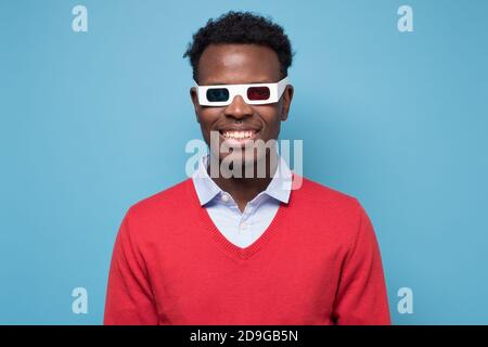 African american man in 3D glasses watching interesting movie on screen Stock Photo