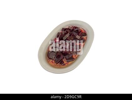 Closeup of chopped beetroot served on a white plate isolated on a white background Stock Photo